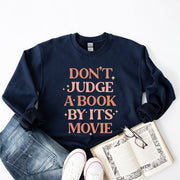 Don't Judge A Book By It's Movie Graphic Sweatshirt | S-XXL
